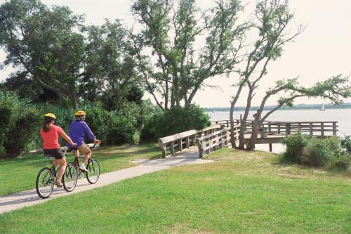 Two bicyclists riding on a path in the Carolina Beach State Park in North Carolina
