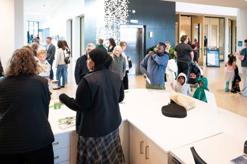 Staff attending to guests and answering questions at the Woodbury Central Park.