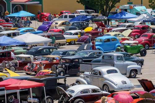a lot filled with antique vehicles during the annual Street Rods event
