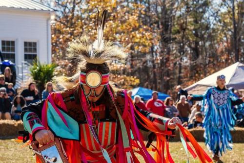 A man in traditional Catawba clothing, dancing