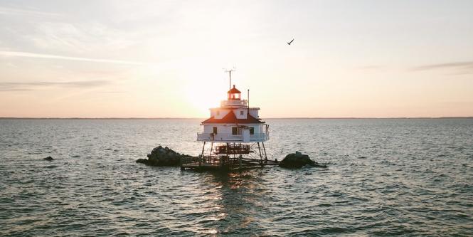 Thomas Point Lighthouse with the sun shining through from behind.