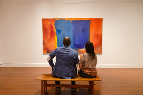 Visitors contemplate a painting on display at the RISD Museum in Providence Rhode Island