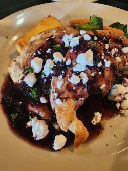 Jaffre's "tin" chicken features seared chicken, blueberry-habanero reduction, crumbled goat cheese plus a vegetable and polenta.