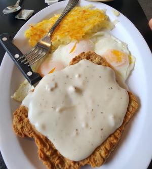 Chicken Fried Steak Breakfast with hashbrowns and fried eggs