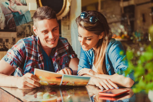 Couple Looking at Menu