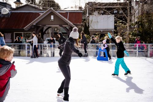 Woman ice skating on an ice skating rink in Highlands, North Carolina.