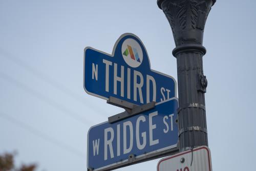 Street signs for the cross section of Third and Ridge on Marquette's historic Third St