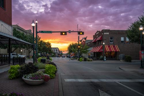 Sunset with purple, yellow, and orange over downtown McKinney