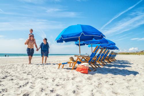 Family Vacationing at Shell Island in Summer