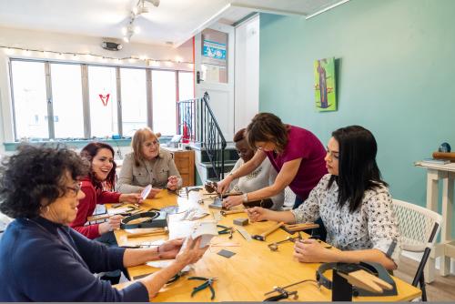 Group enjoys jewelry making class at The Watchmaker's Daughter