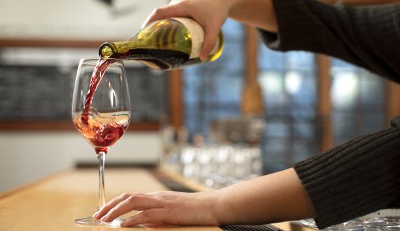 Wine being poured into a glass at New York Kitchen; Photo Credit: Grant Taylor Photography Wine being poured into a glass at New York Kitchen; Photo Credit: Grant Taylor Photography