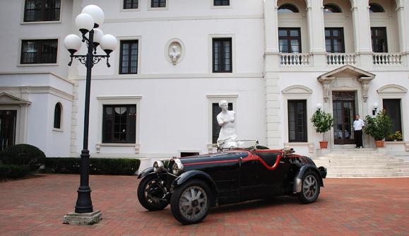 A classic car parked out front of Geneva on the Lake A classic car parked out front of Geneva on the Lake