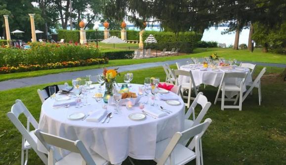 Chairs and tables setup of an outdoor wedding at Geneva on the Lake Chairs and tables setup of an outdoor wedding at Geneva on the Lake