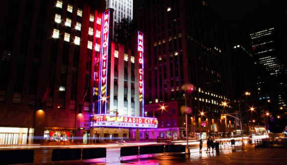 Exterior of Radio City Music Hall at night with fountain Exterior of Radio City Music Hall at night with fountain