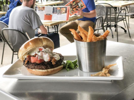 burger and fries on outdoor patio in barleycorn's northern kentucky