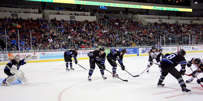 The Wichita Thunder hockey team face off on the ice at INTRUST Bank Arena in Wichita