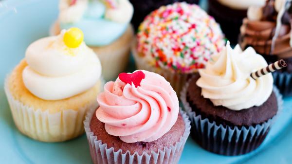 Five assorted cupcakes with colorful toppings and frosting from Nadia Cakes in Maple Grove, MN