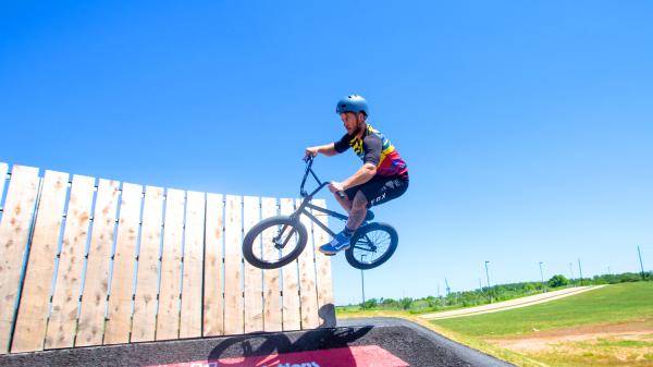 Bike rider on the pump track at Crown Festival Park at Sugar Land