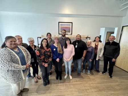 Attendees of the December 2025 ACE class pose at Fire of Sandia.