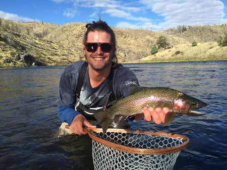 Chase Navratil with a Rainbow Trout | Photo: Alex Mansfield