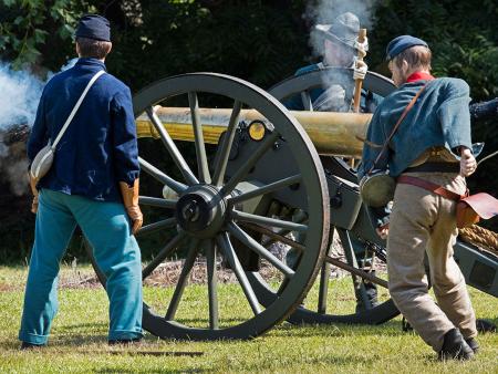 Canon firing at Bentonville Battlefield Civil War Reenactment in Four Oaks, NC.