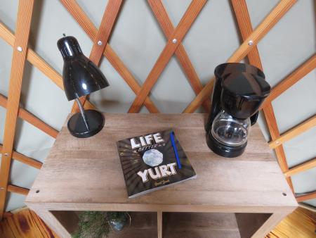 photo of a guestbook and coffee maker at a yurt in Alexandria ky at aj jolly park