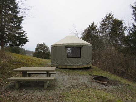 photo of a yurt, fire pit, and picnic table at aj jolly park in Alexandria ky