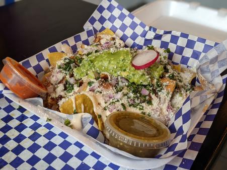 basket of nachos with guacamole in covington ky at olla