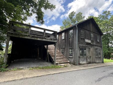 The exterior of the W.M.A. Heiss Coachmaker shop.