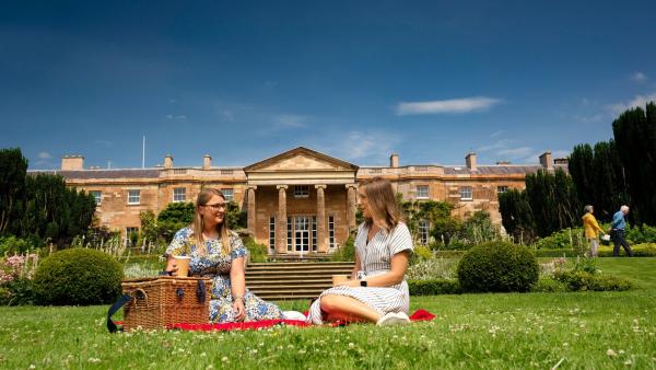 Two women enjoying a picnic at Hillsborough Castle and Gardens