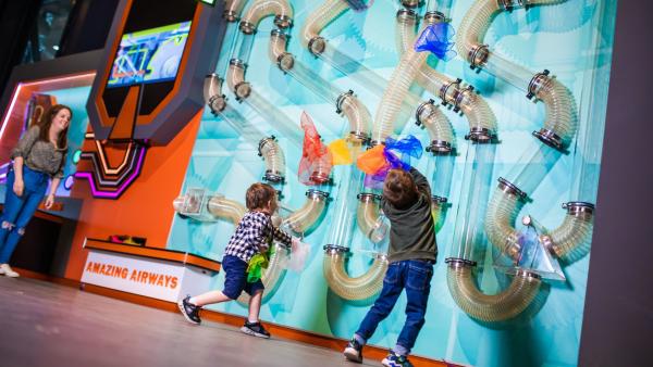 Two children playing indoors at W5 Belfast