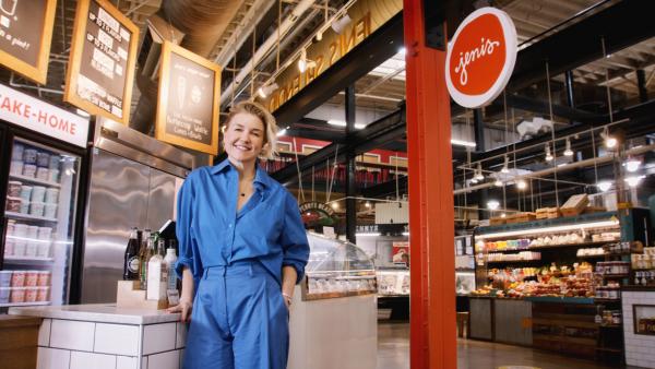 Jeni Britton standing at Jeni's Ice Cream kiosk in the North Market