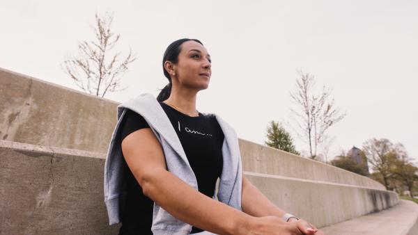 Lubna Najjar staring thoughtfully across a park