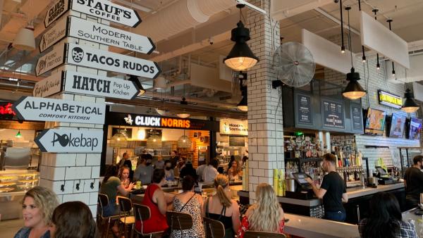 Signs lead the way for various restaurants inside Budd Dairy Food Hall