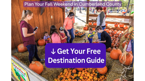 Families with children pick pumpkins at a pumpkin patch in Cumberland County, North Carolina. A bold purple call-to-action button reads ‘↓ Get Your Free Destination Guide.’