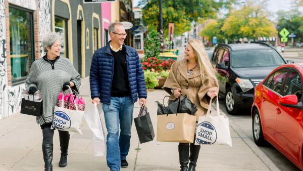 Man and two women shopping in downtown Green Bay