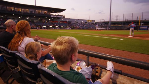 Family watching Gary SouthShore RailCats Baseball