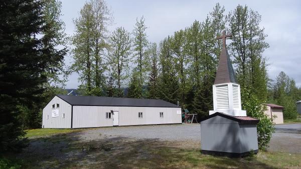 a church in a small town. Trees in background