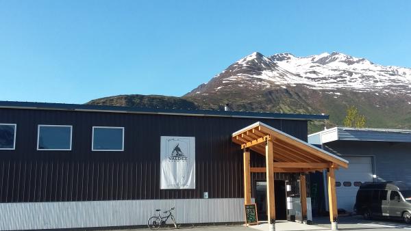 a brewery next to a mountain