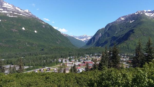 small town of Valdez with mountains and a canyon in background