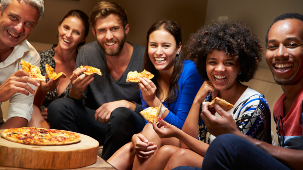 A group enjoying pizza at a Wausau restaurant