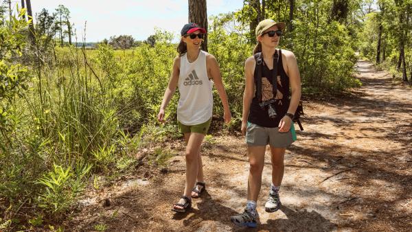 Two women hiking in Carolina Beach State Park
