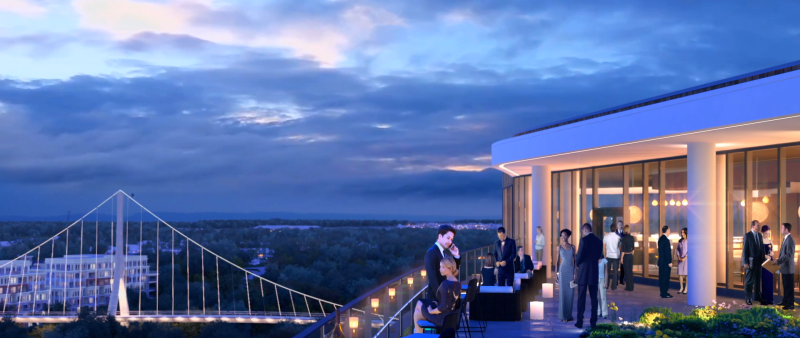 View of the rooftop bar at the AC Marriott at dusk overlooking the pederstrain bridge
