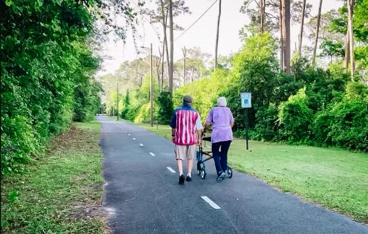 Elderly couple taking a stroll down Port City Trail