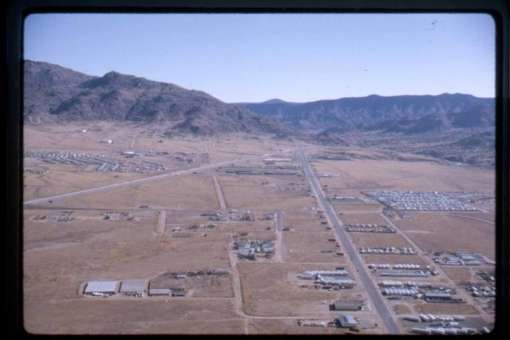 I-40 (left) enters Tijeras Canyon, conjoining with Central Avenue/Route 66 (center right).