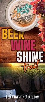 A cup of beer and a vineyard on the cover of the 2022 Beer, Wine & Shine Brochure for Johnston County, NC.