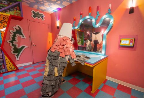Artists turns trash into art and fashion at Meow Wolf Denver