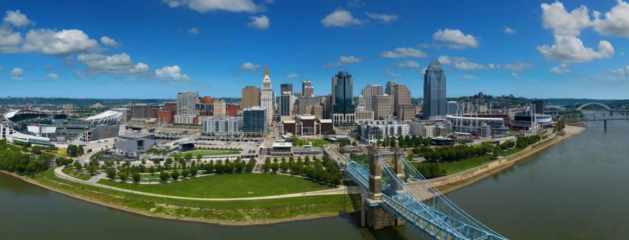 Image is an areial view of the City of Cincinnati from the Ohio River.