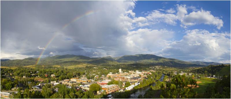 a rainbow fills the sky over downtown Steamboat Springs