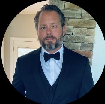 headshot of a man in a tux